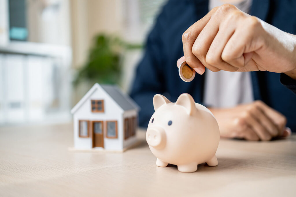 person saving money with pigg